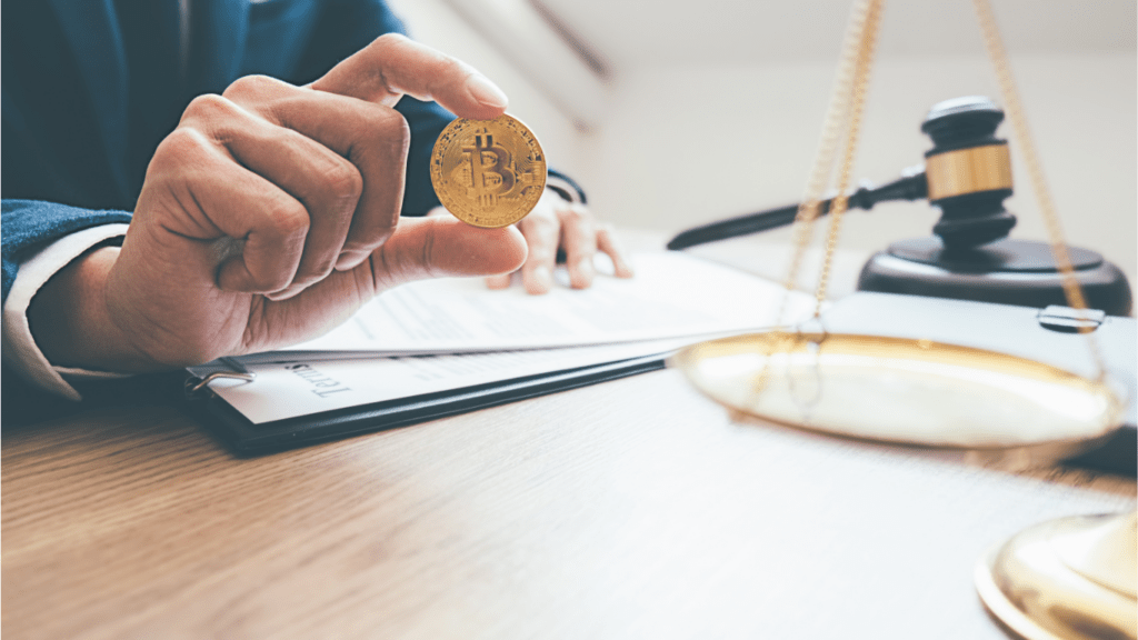 A Man holding a Bitcoin